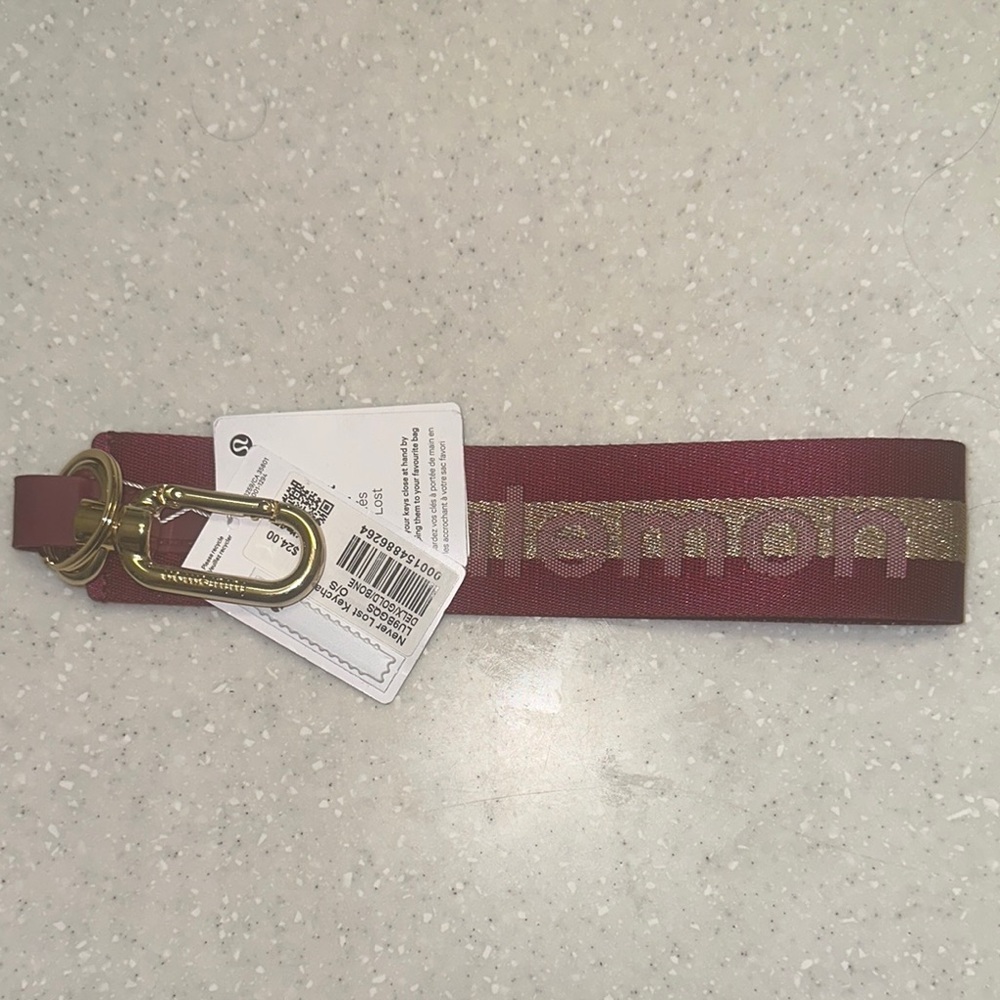 Lululemon Athletica Maroon Key Chain with Gold Accent